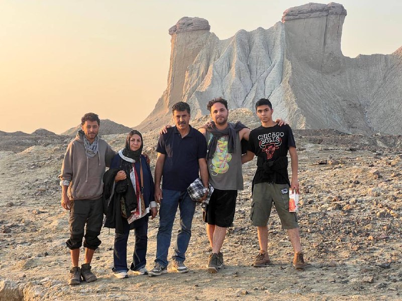 The whole family together in the desert at golden hour